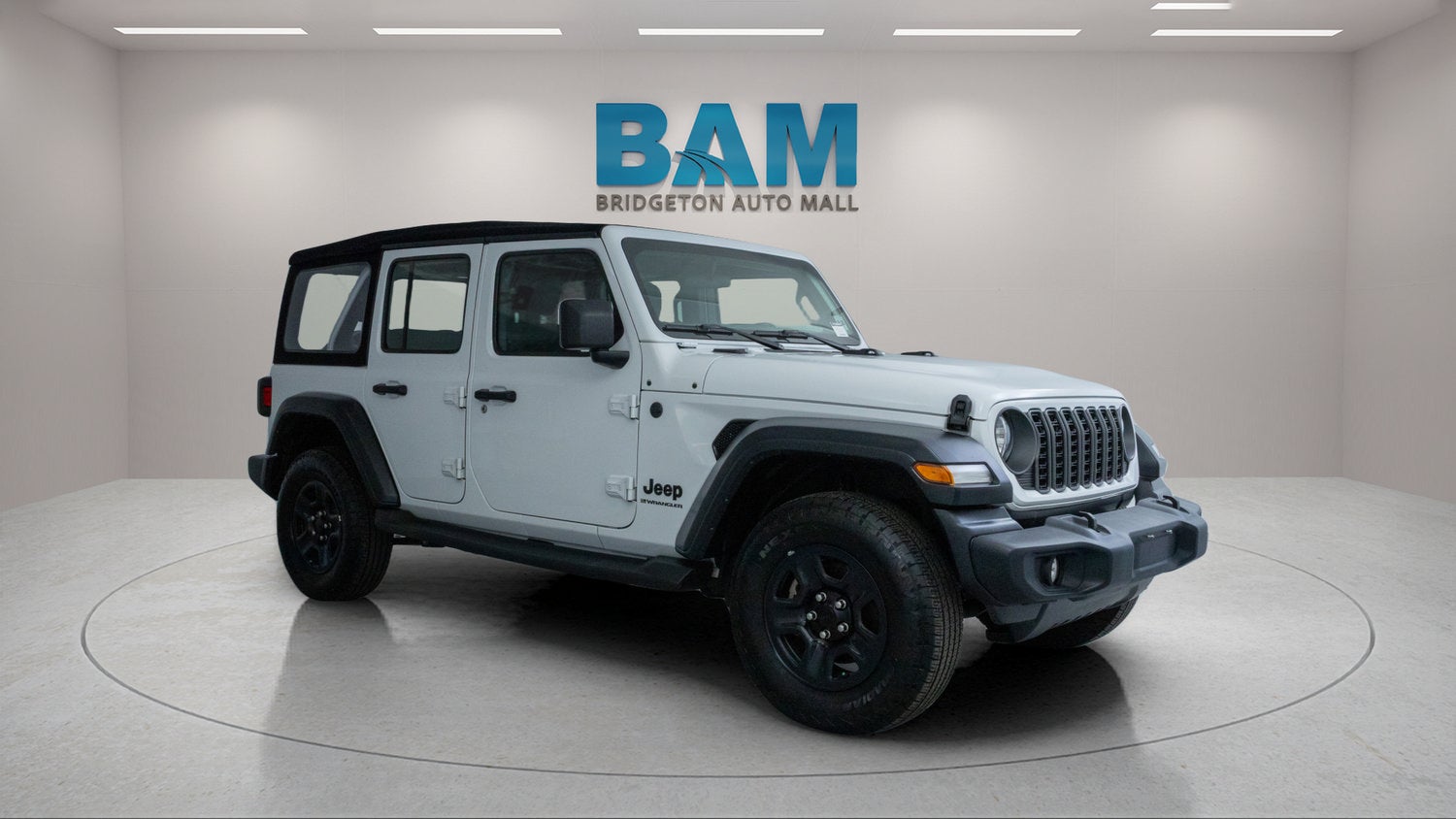 2024 Jeep Wrangler 4-Door Sport 4x4 in White — front three-quarter view