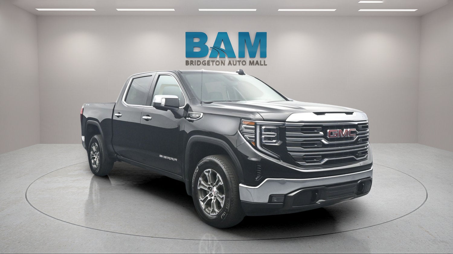 2026 GMC Sierra 1500 SLT in Onyx Black — front three-quarter view