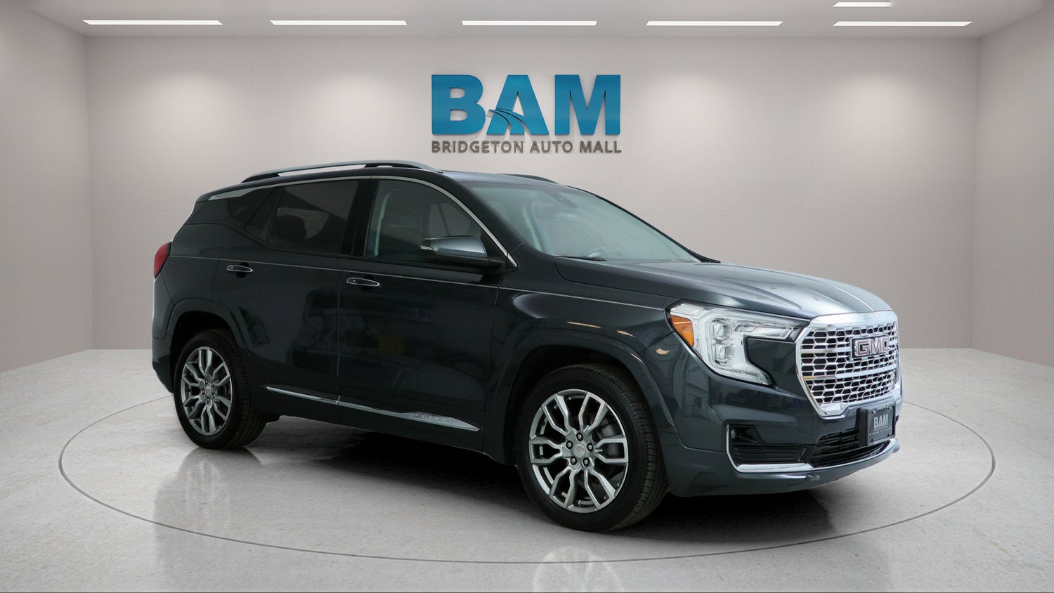 2022 GMC Terrain Denali in Hunter Metallic — front three-quarter view